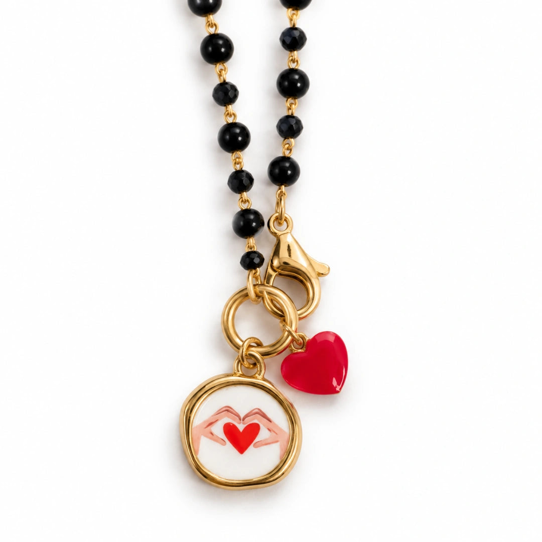 Collana Favola Cuore tra le Mani con Cristalli Neri Oro