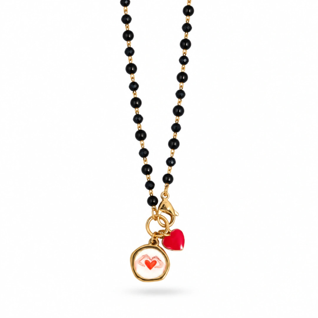 Collana Favola Cuore tra le Mani con Cristalli Neri Oro