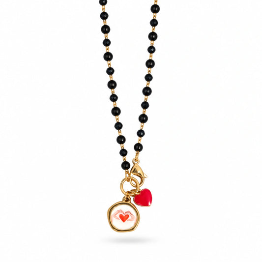 Collana Favola Cuore tra le Mani con Cristalli Neri Oro